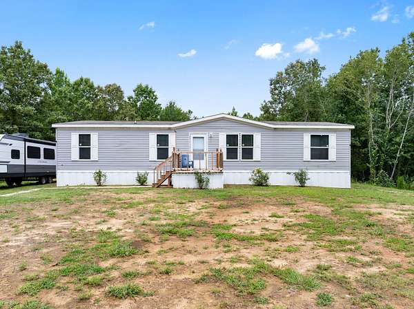 30 Acres of Land with Home for Sale in Burnsville, Mississippi