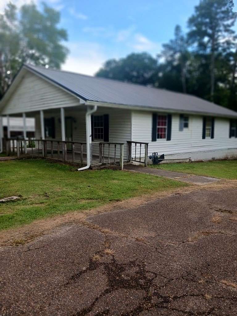 Land with Home for Sale in Camden, Tennessee