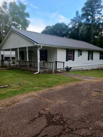 Land with Home for Sale in Camden, Tennessee