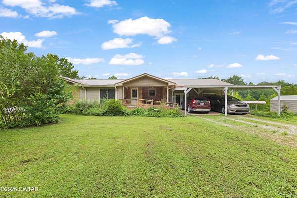 14 Acres of Land with Home for Sale in Scotts Hill, Tennessee