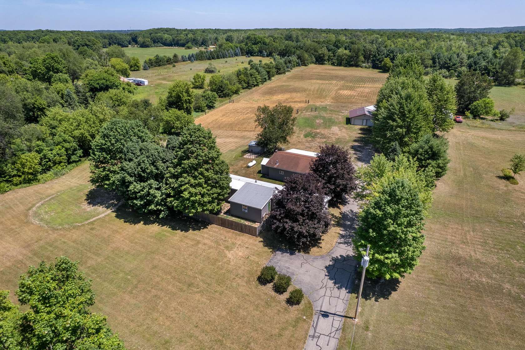 6.65 Acres of Land with Home for Sale in Sand Lake, Michigan
