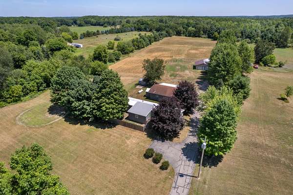 6.65 Acres of Land with Home for Sale in Sand Lake, Michigan