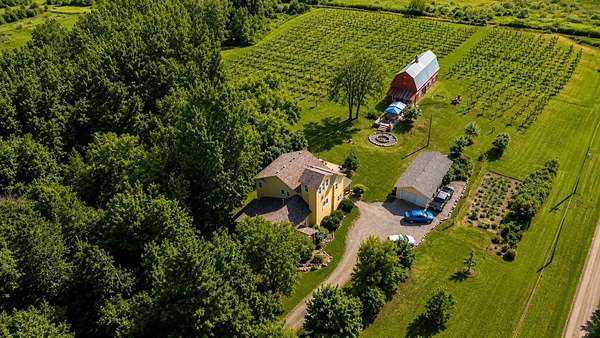 24 Acres of Agricultural Land with Home for Sale in Milaca, Minnesota