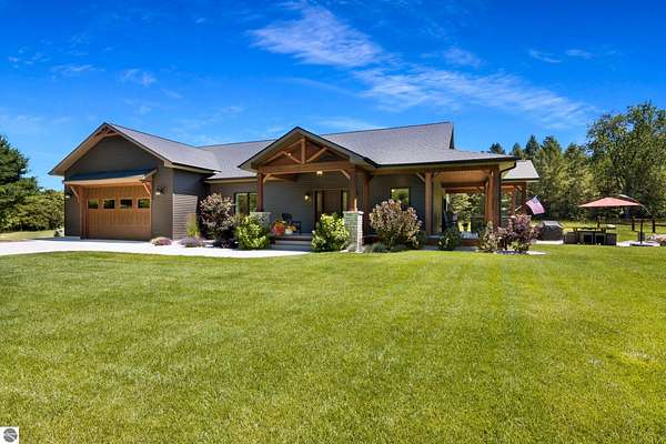 30.9 Acres of Land with Home for Sale in Alden, Michigan