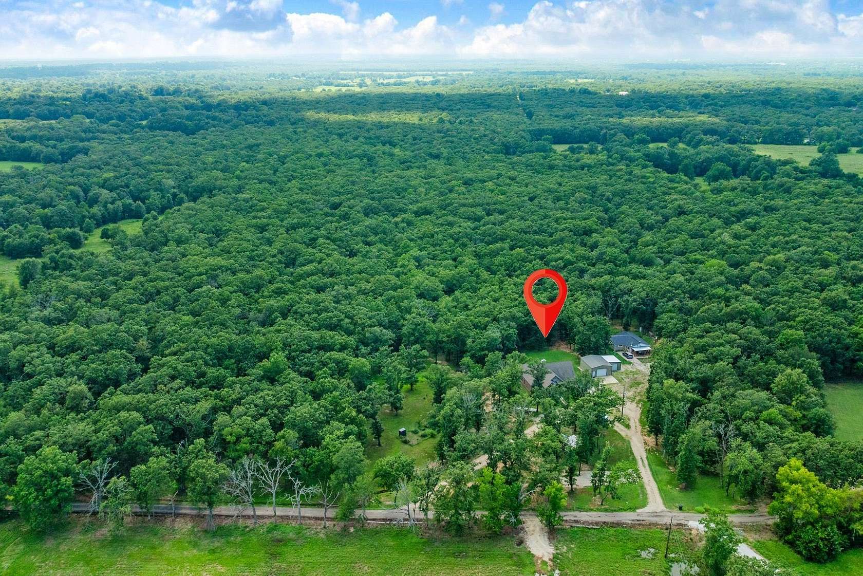 11.4 Acres of Land with Home for Sale in Paris, Texas