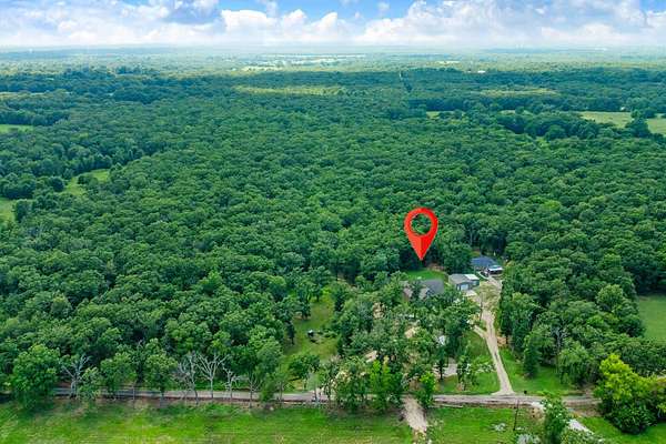 11.4 Acres of Land with Home for Sale in Paris, Texas