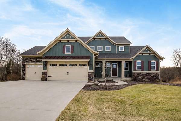 1.73 Acres of Land with Home for Sale in Rockford, Michigan