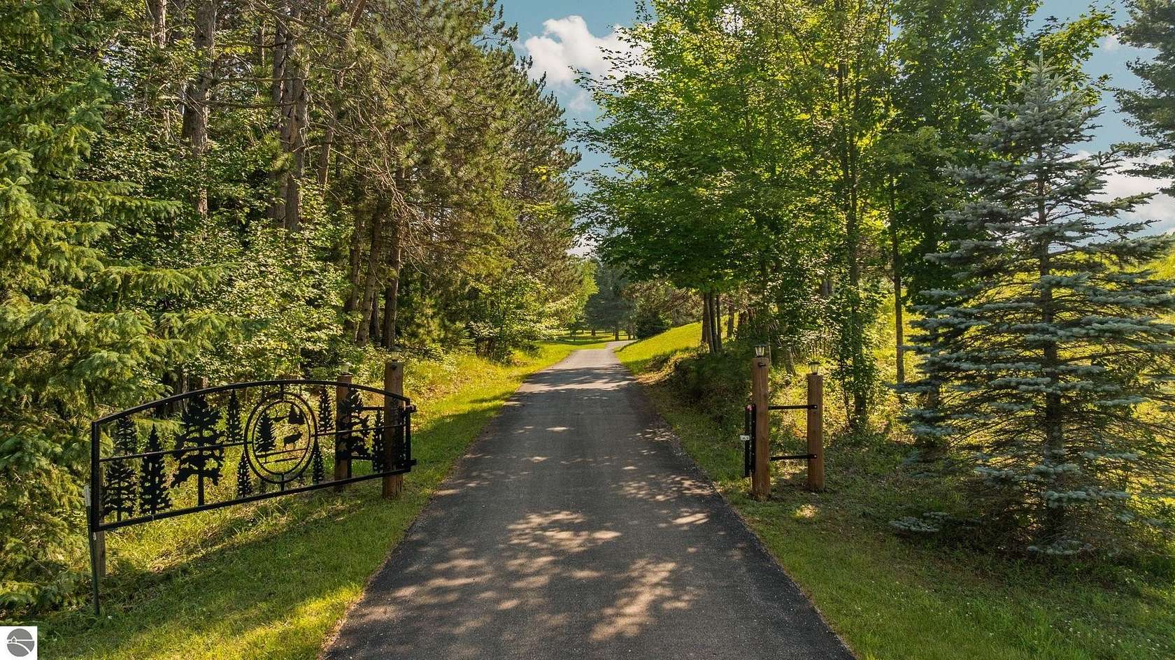 12.3 Acres of Land with Home for Sale in Bellaire, Michigan