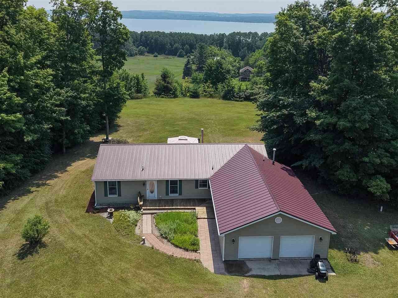 11.4 Acres of Recreational Land with Home for Sale in Charlevoix, Michigan