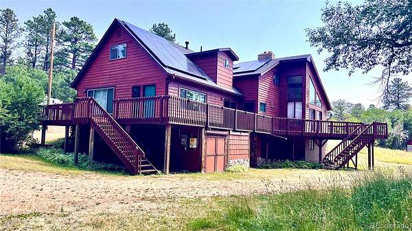 6.46 Acres of Land with Home for Sale in Palmer Lake, Colorado