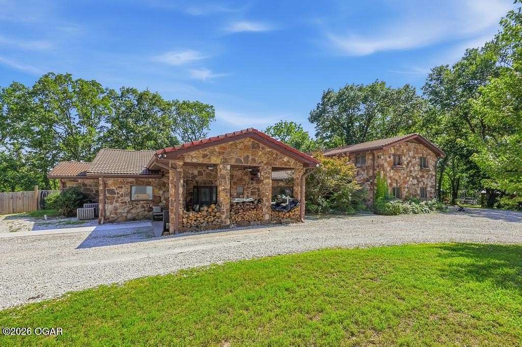 6.7 Acres of Land with Home for Sale in Carthage, Missouri