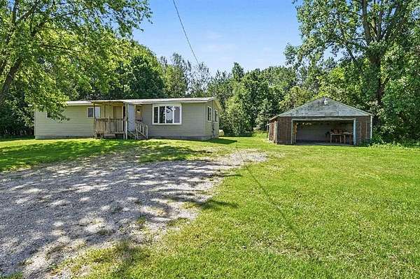1.58 Acres of Land with Home for Sale in Rhodes, Michigan