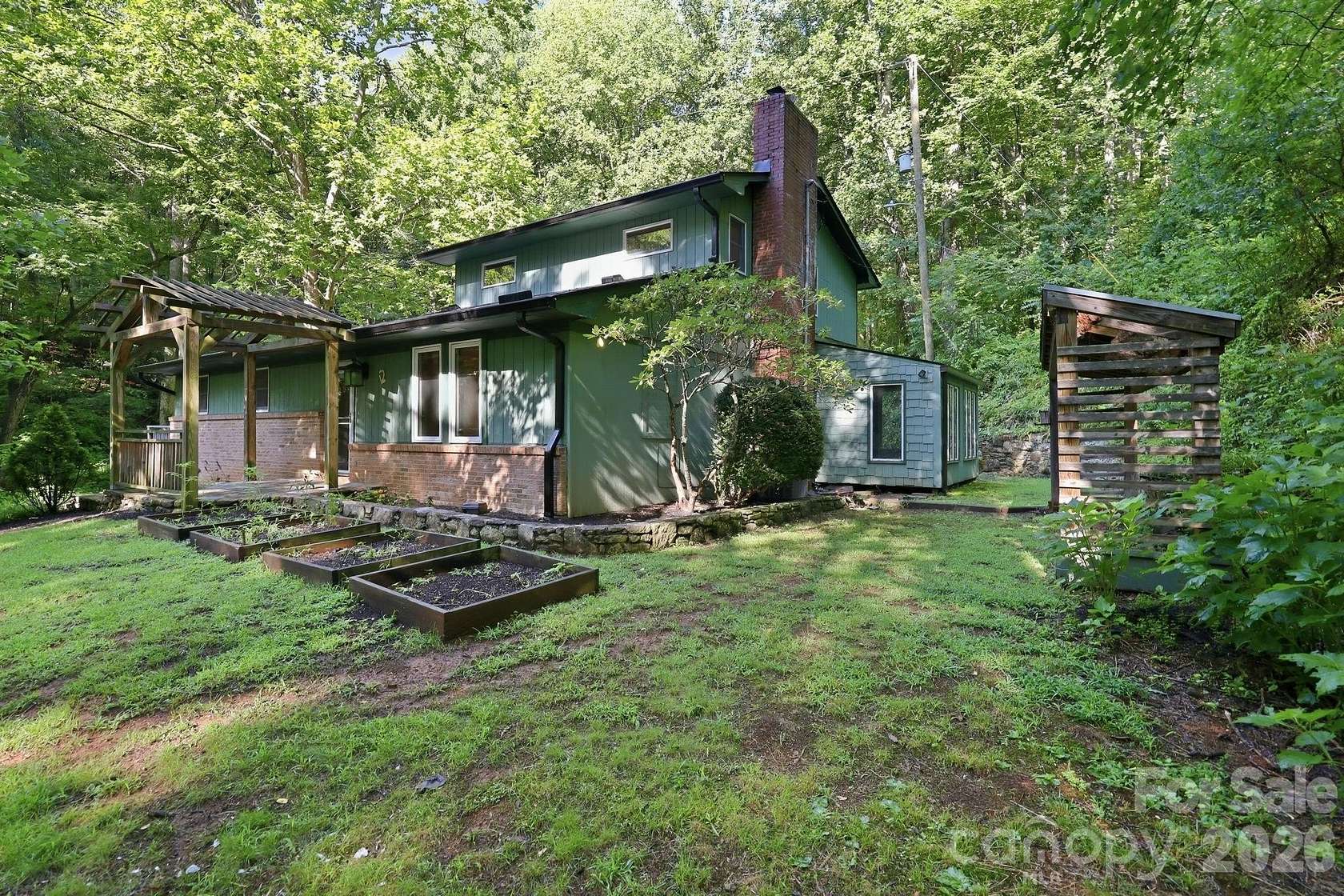 8.73 Acres of Land with Home for Sale in Candler, North Carolina
