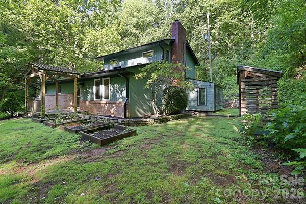8.73 Acres of Land with Home for Sale in Candler, North Carolina