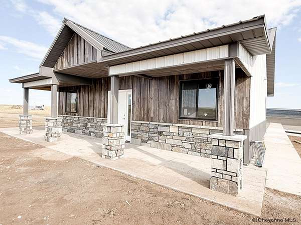 5.25 Acres of Land with Home for Sale in Pine Bluffs, Wyoming
