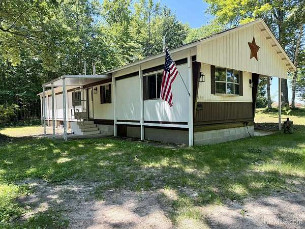2 Acres of Land with Home for Sale in Garden, Michigan