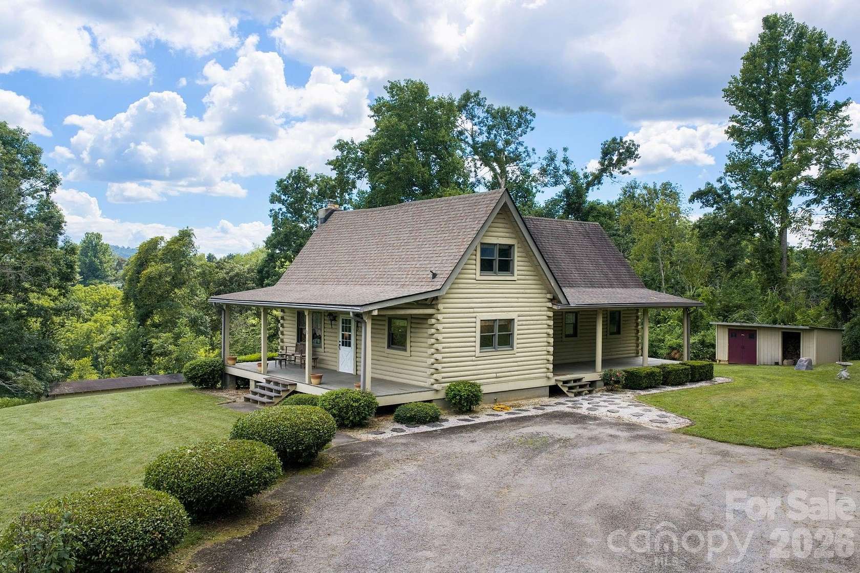 6.26 Acres of Land with Home for Sale in Fairview, North Carolina