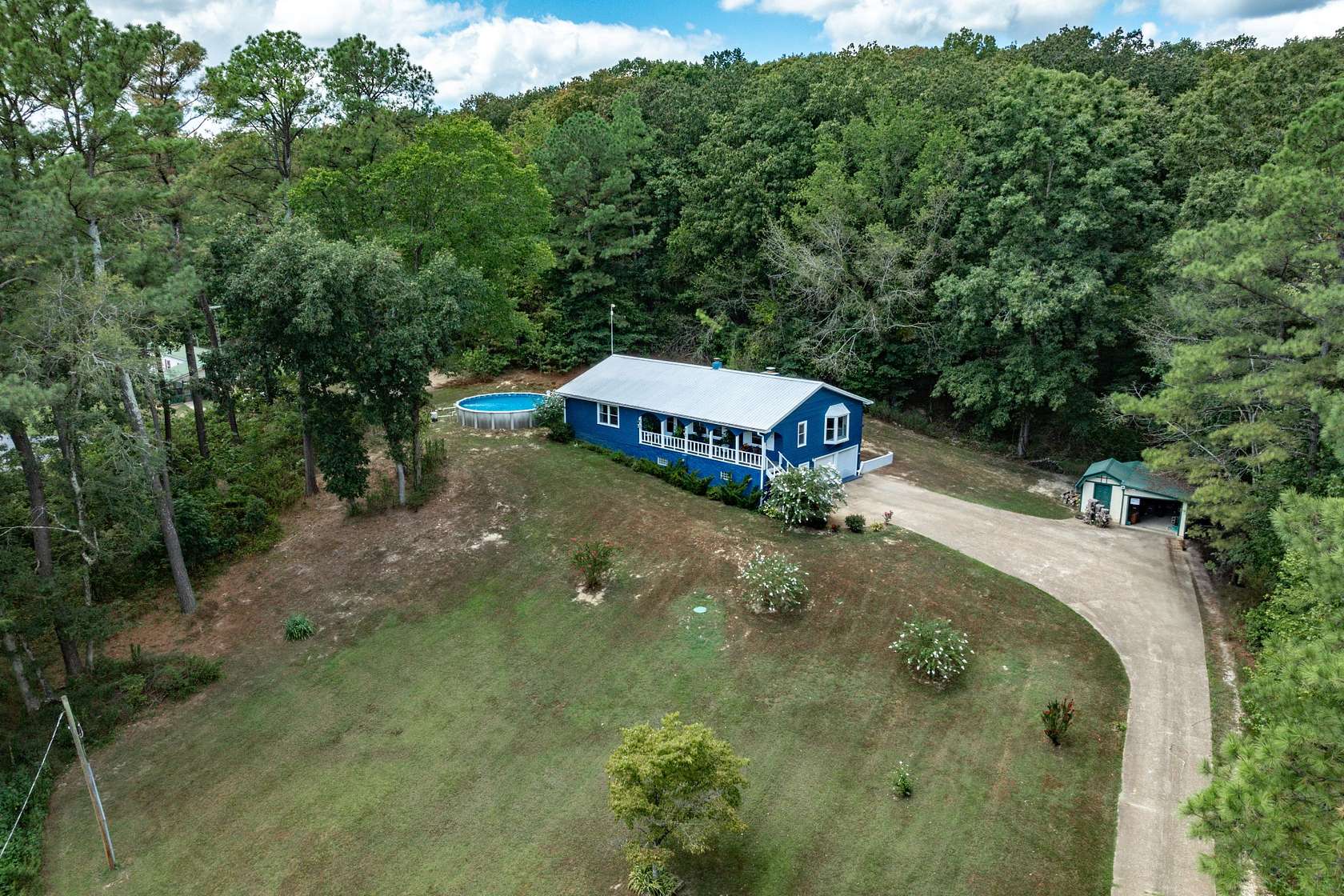 4.74 Acres of Land with Home for Sale in Eva, Tennessee