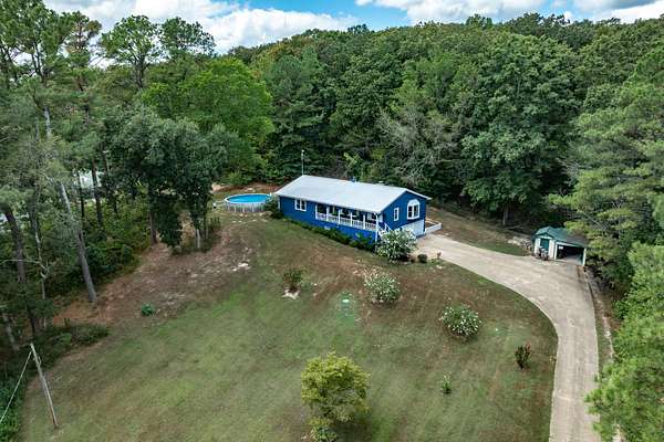 4.74 Acres of Land with Home for Sale in Eva, Tennessee
