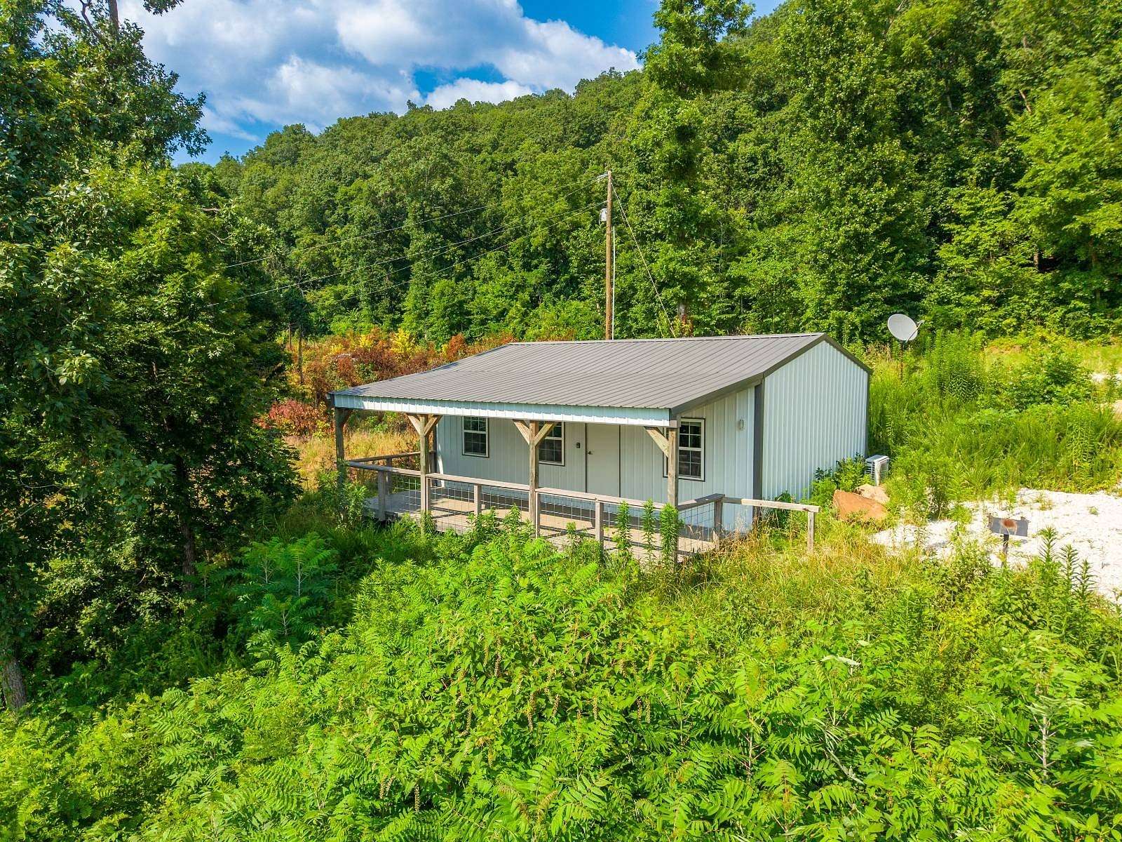 3.45 Acres of Land with Home for Auction in Jasper, Arkansas