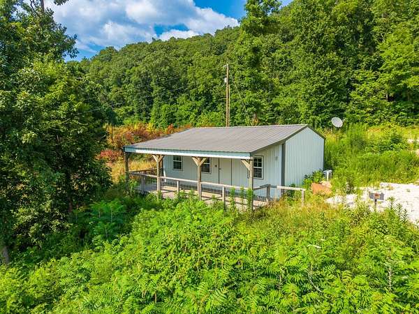 3.45 Acres of Land with Home for Auction in Jasper, Arkansas