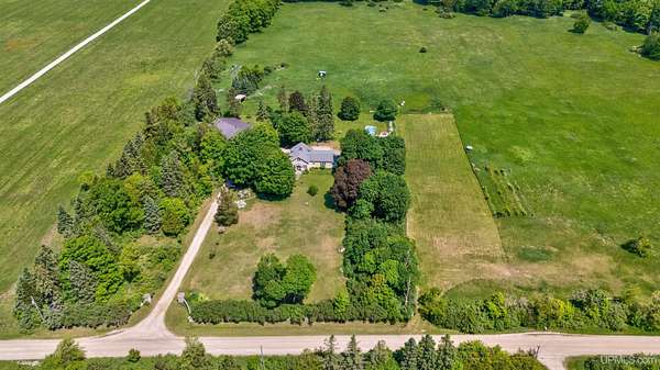 20 Acres of Agricultural Land with Home for Sale in Garden, Michigan