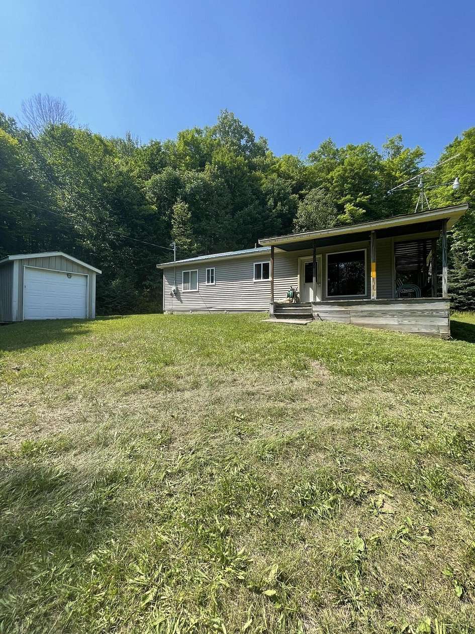 40 Acres of Recreational Land with Home for Sale in Hulbert, Michigan