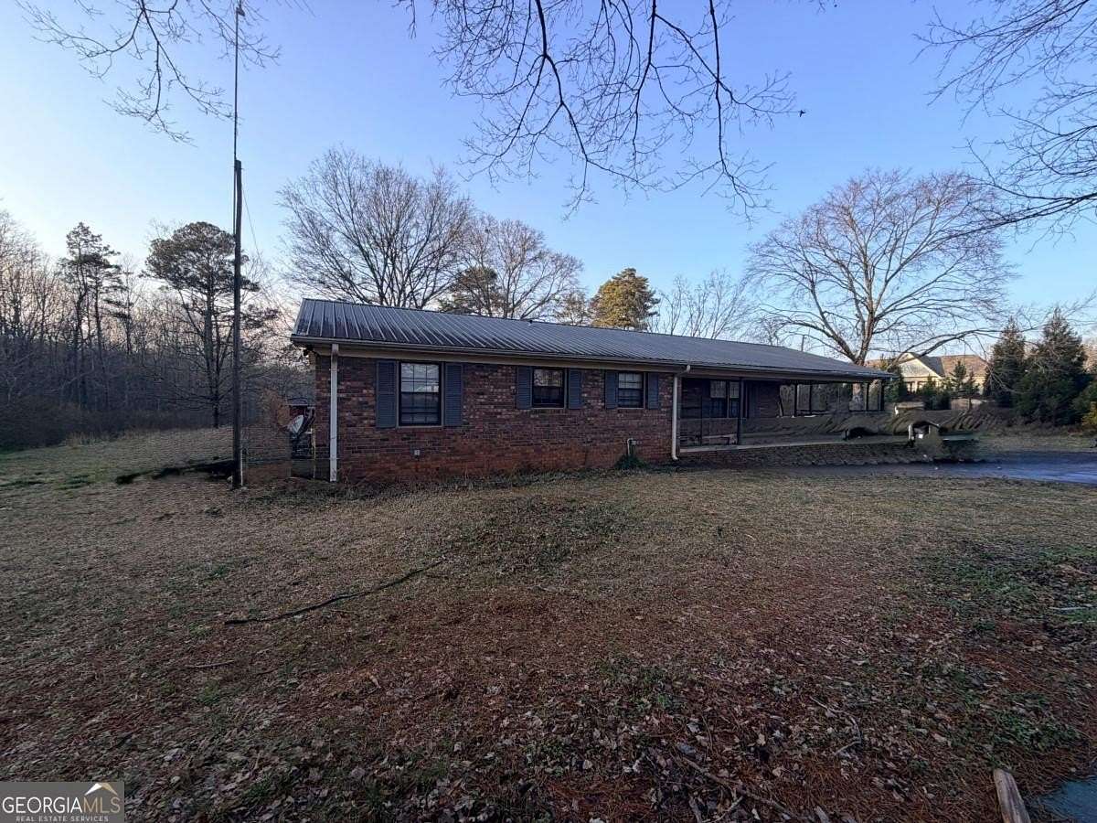 1.5 Acres of Land with Home for Sale in Commerce, Georgia