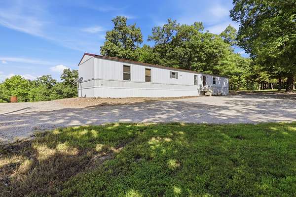 80 Acres of Recreational Land with Home for Sale in Wheatland, Missouri