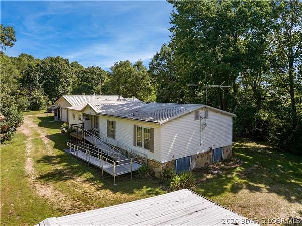 14 Acres of Land with Home for Sale in Macks Creek, Missouri
