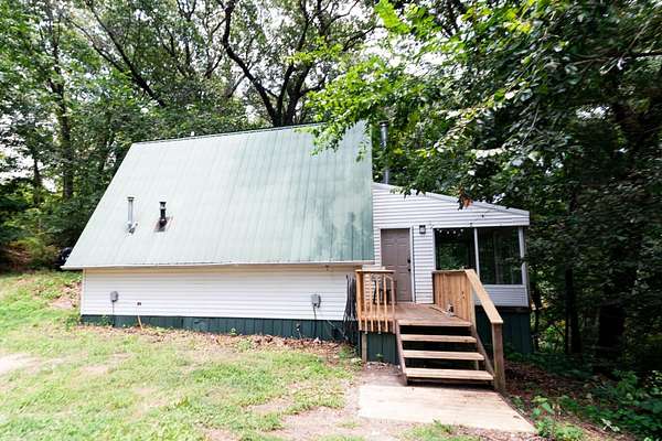 7.38 Acres of Land with Home for Lease in Pineville, Missouri