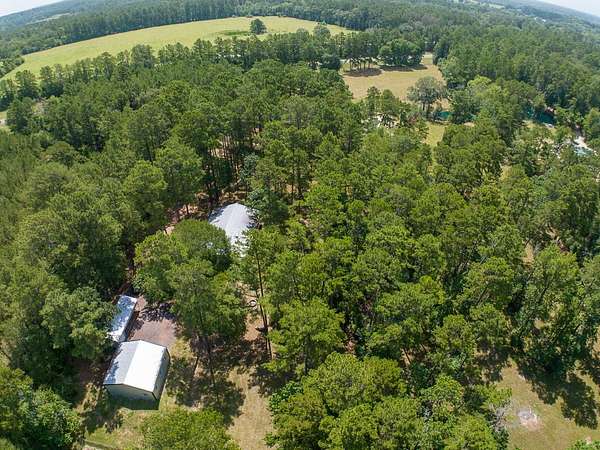 13.6 Acres of Land with Home for Sale in Huntsville, Texas