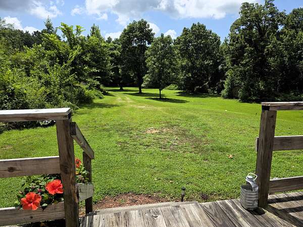 4.8 Acres of Land with Home for Sale in Holladay, Tennessee