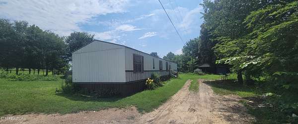 6.32 Acres of Land with Home for Sale in Ten Mile, Tennessee