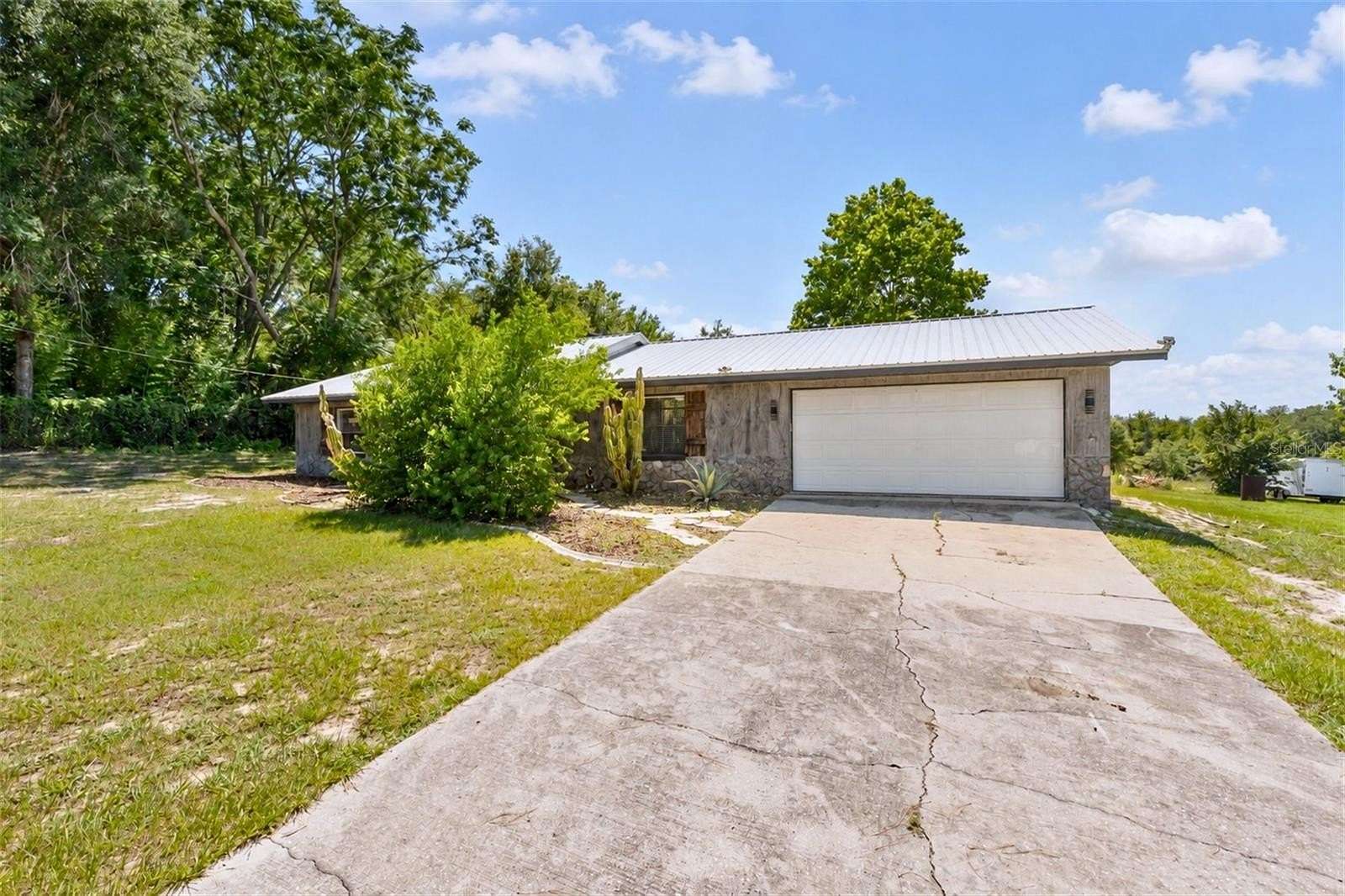 5.33 Acres of Land with Home for Sale in Lady Lake, Florida