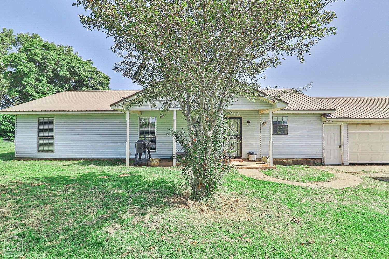 4.18 Acres of Land with Home for Sale in Hickory Ridge, Arkansas