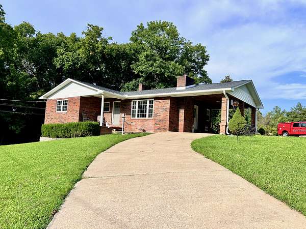 6.75 Acres of Land with Home for Sale in Bumpus Mills, Tennessee