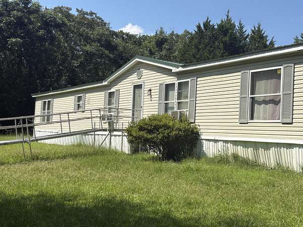 5.6 Acres of Land with Home for Sale in Rembert, South Carolina