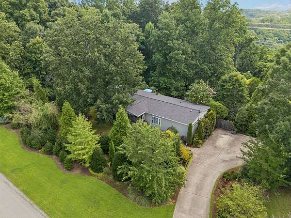 5.12 Acres of Land with Home for Sale in Pegram, Tennessee