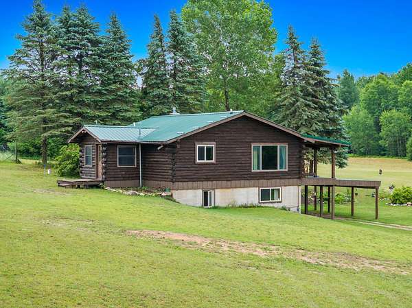 63.8 Acres of Land with Home for Sale in Harrietta, Michigan