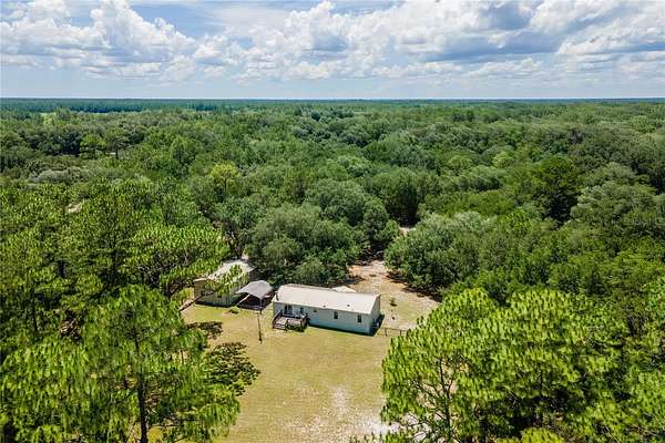 10.2 Acres of Land with Home for Sale in Citra, Florida