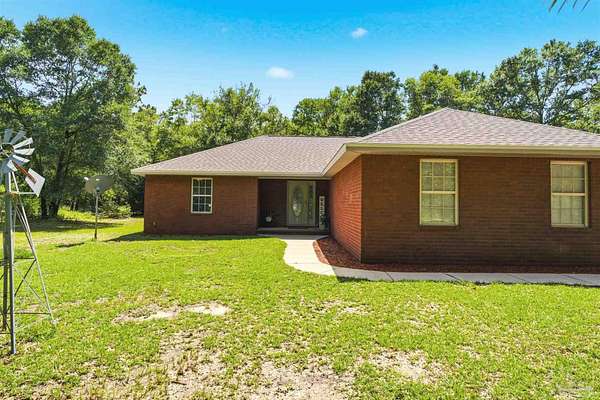 2.37 Acres of Land with Home for Sale in Holt, Florida