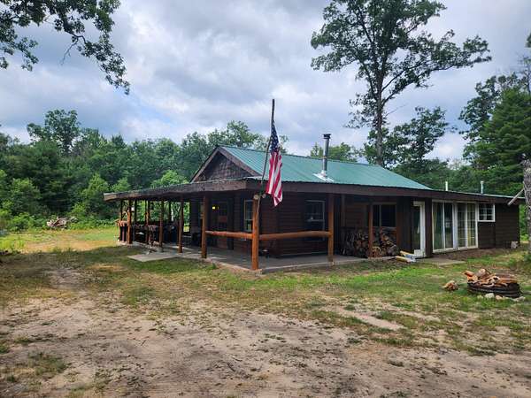 5 Acres of Land with Home for Sale in Idlewild, Michigan