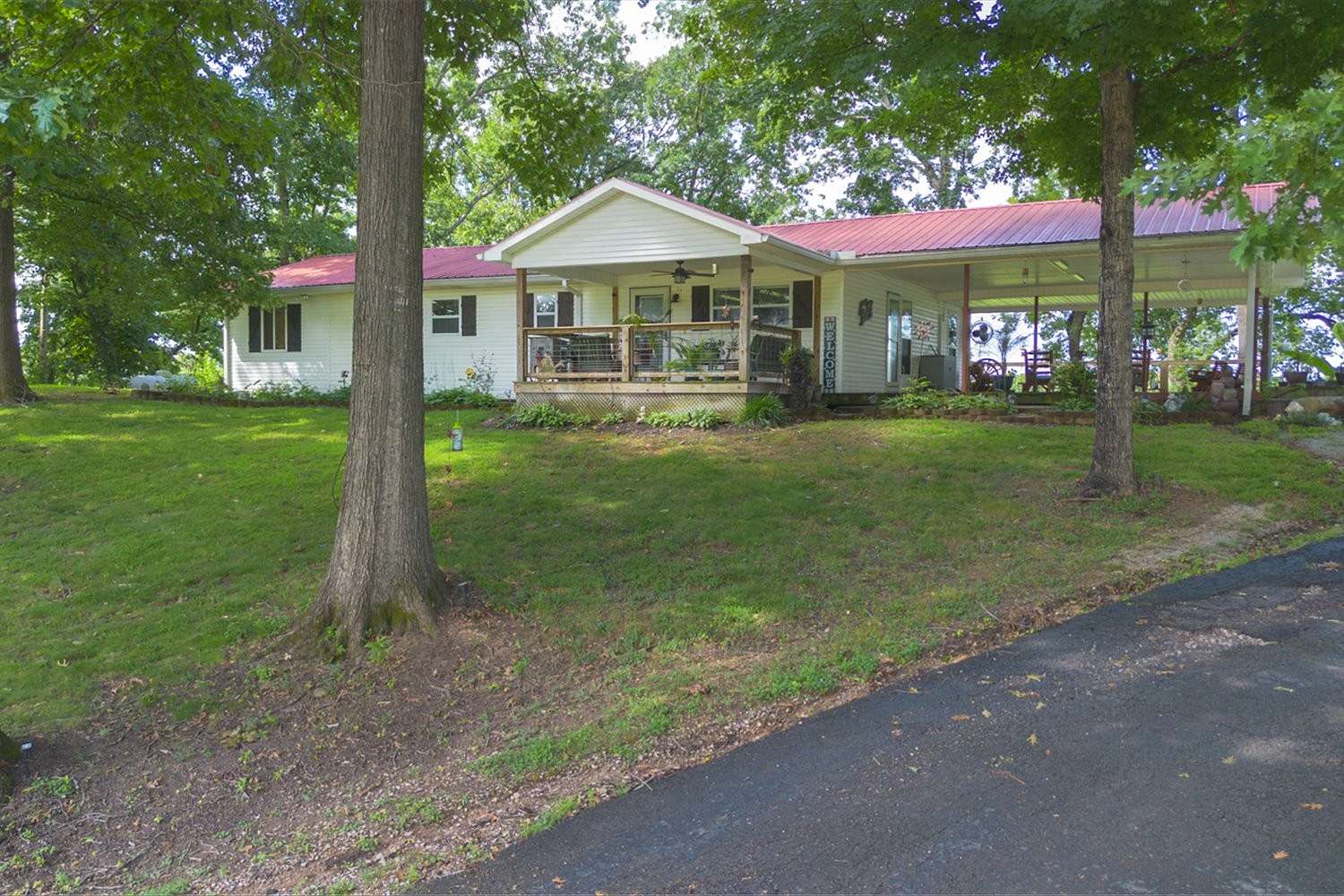 3.2 Acres of Land with Home for Sale in Clifton, Tennessee