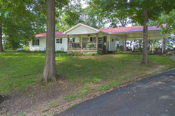 3.2 Acres of Land with Home for Sale in Clifton, Tennessee