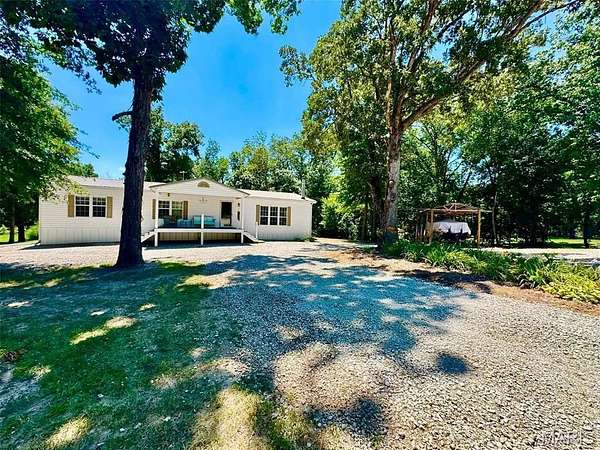 5.56 Acres of Land with Home for Sale in Monroe City, Missouri