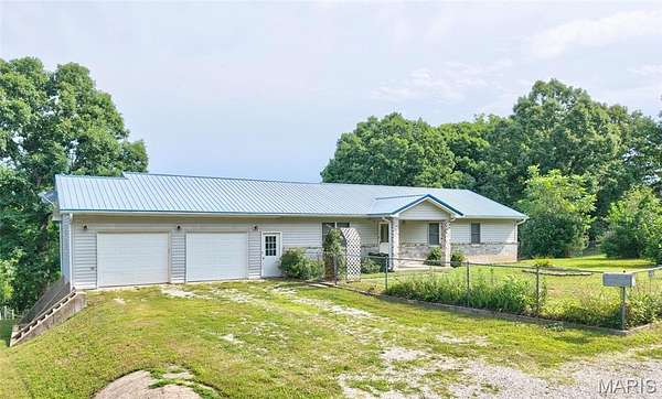 6.8 Acres of Land with Home for Sale in St. Robert, Missouri