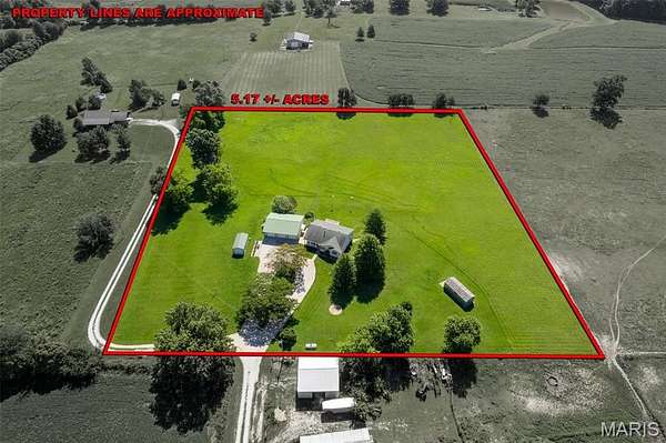 5 Acres of Land with Home for Sale in Oak Ridge, Missouri
