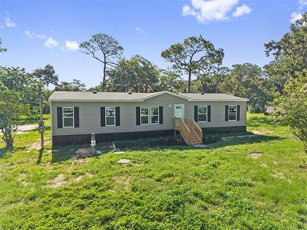 2.5 Acres of Land with Home for Sale in Spring Hill, Florida