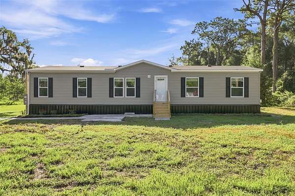 2.5 Acres of Land with Home for Sale in Spring Hill, Florida